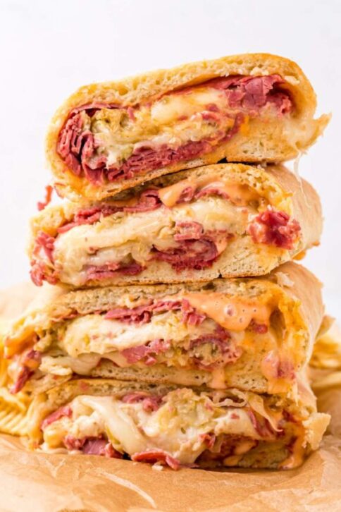 Reuben Garbage Bread pieces stacked on cutting board