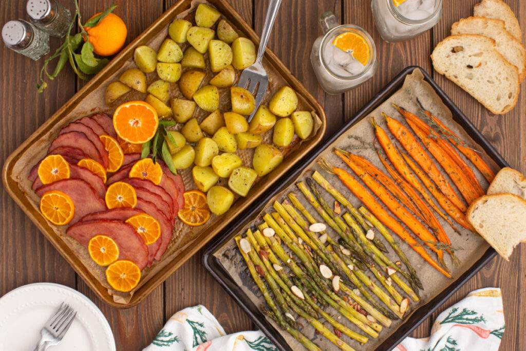 2 sheet pans with easter dinner items on them