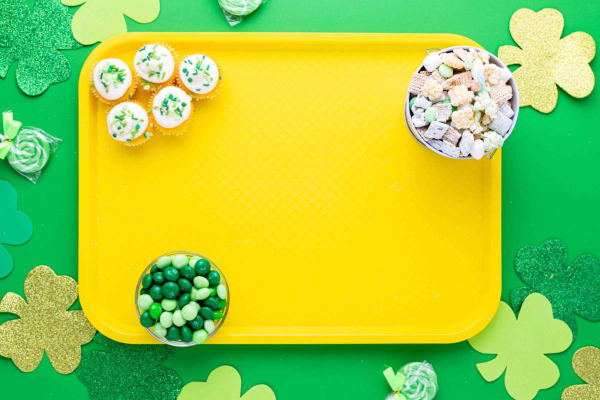 cupcakes, candies and snack mix on a tray