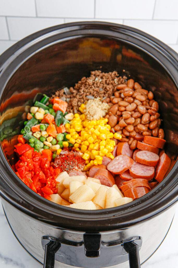 Crockpot Texas Cowboy Stew ingredients in a slow cooker