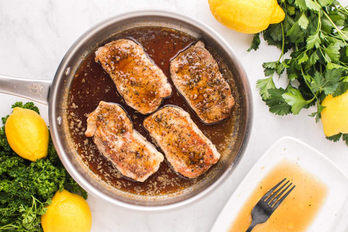 adding pork chops to pan