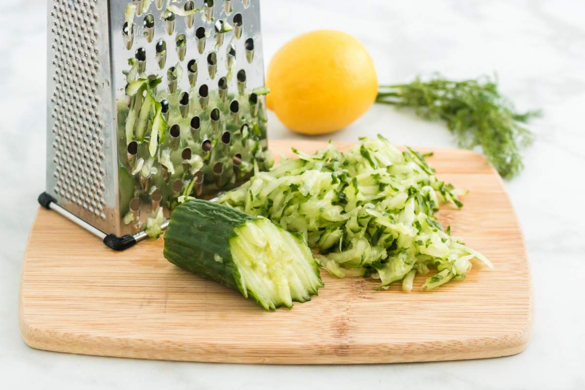 cucumber grated on a butting board