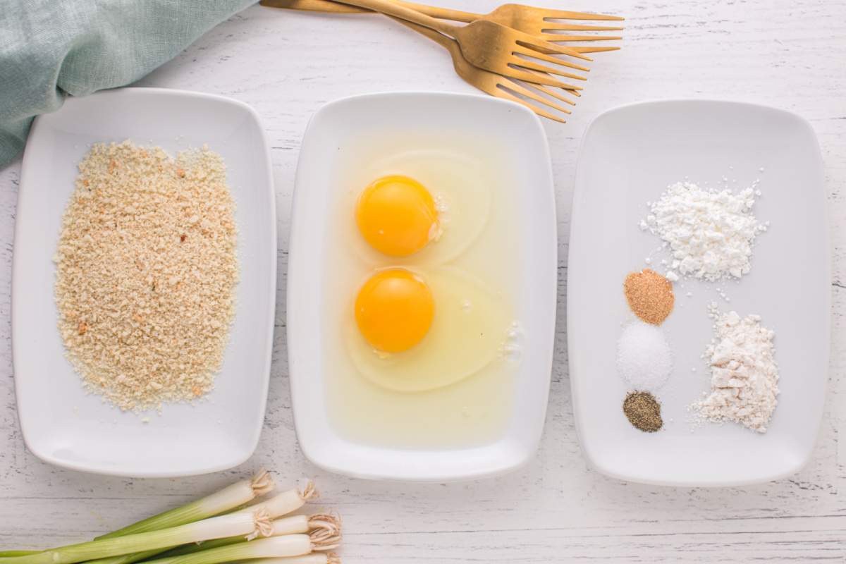 bread crumbs, eggs and seasoning in shallow bowls