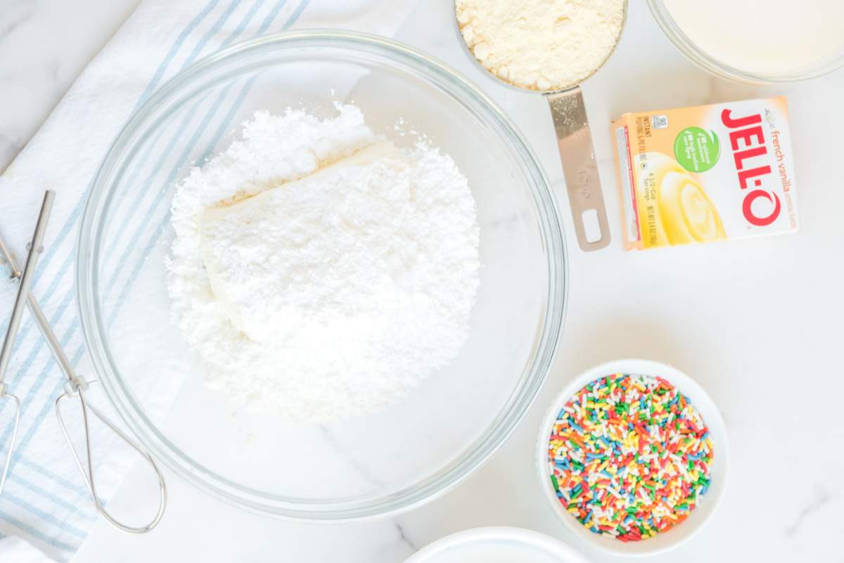 cream cheese and powdered sugar in a bowl