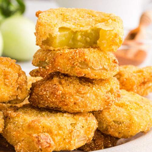 Fried Green Tomatoes stacked on a plate