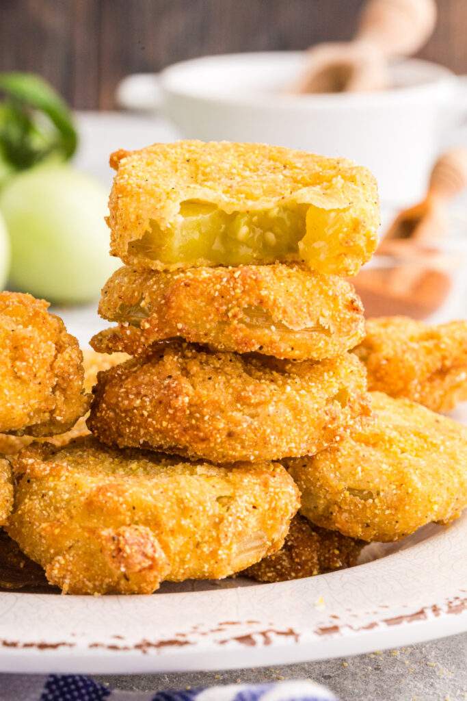 Fried Green Tomatoes stacked on a plate