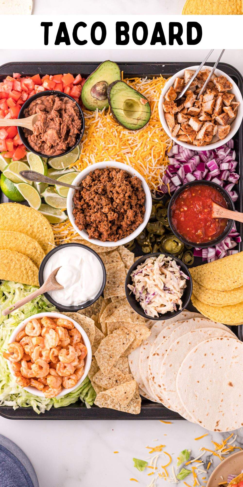 It is taco night, and this is the build your own taco board that everyone can gather around. A perfect themed charcuterie dinner board. via @familyfresh