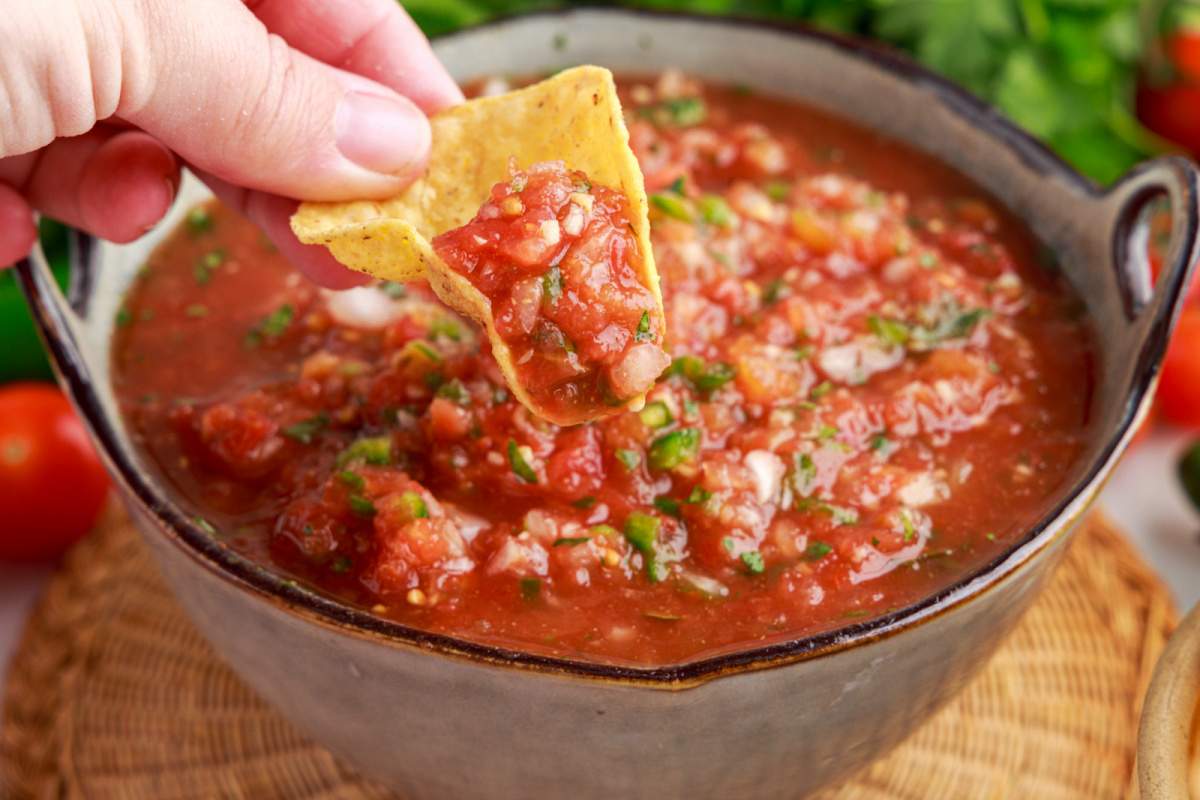chip dipping into Restaurant Style Salsa
