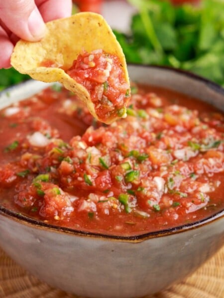Chip dipping into Restaurant Style Salsa