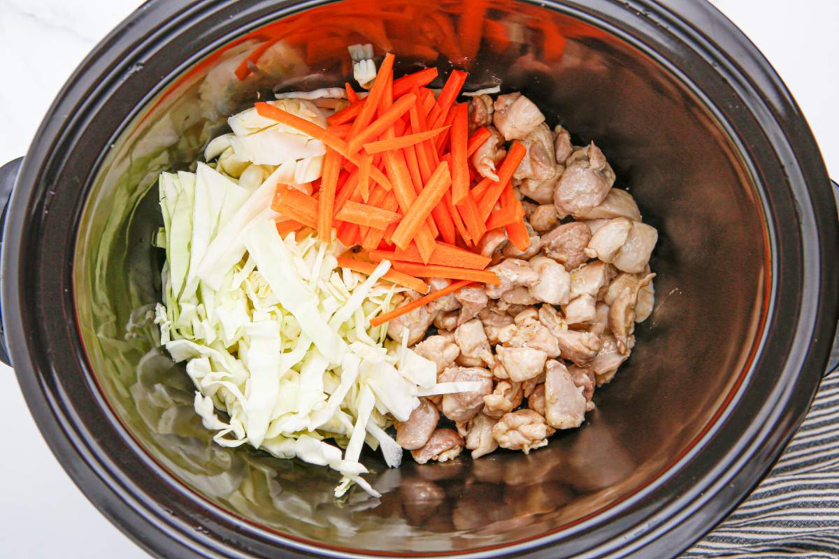 chicken and vegetables added to slow cooker