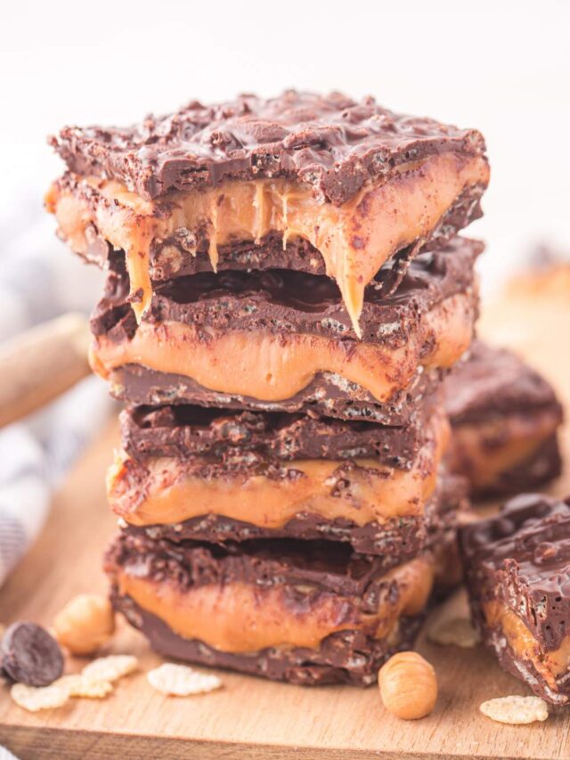 Homemade 100 Grand Bars stacked on a plate