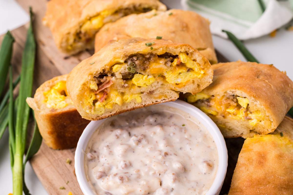 Breakfast Garbage Bread sliced served with some sausage gravy