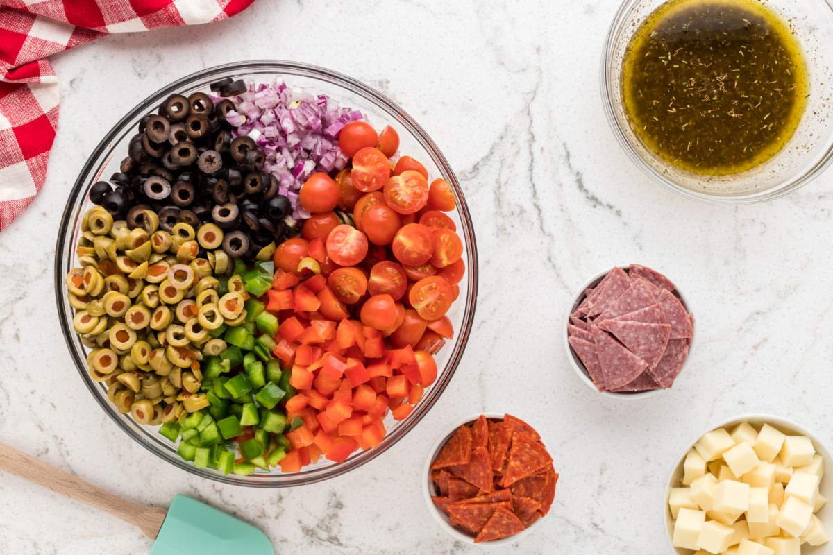 veggies added to bowl with pasta