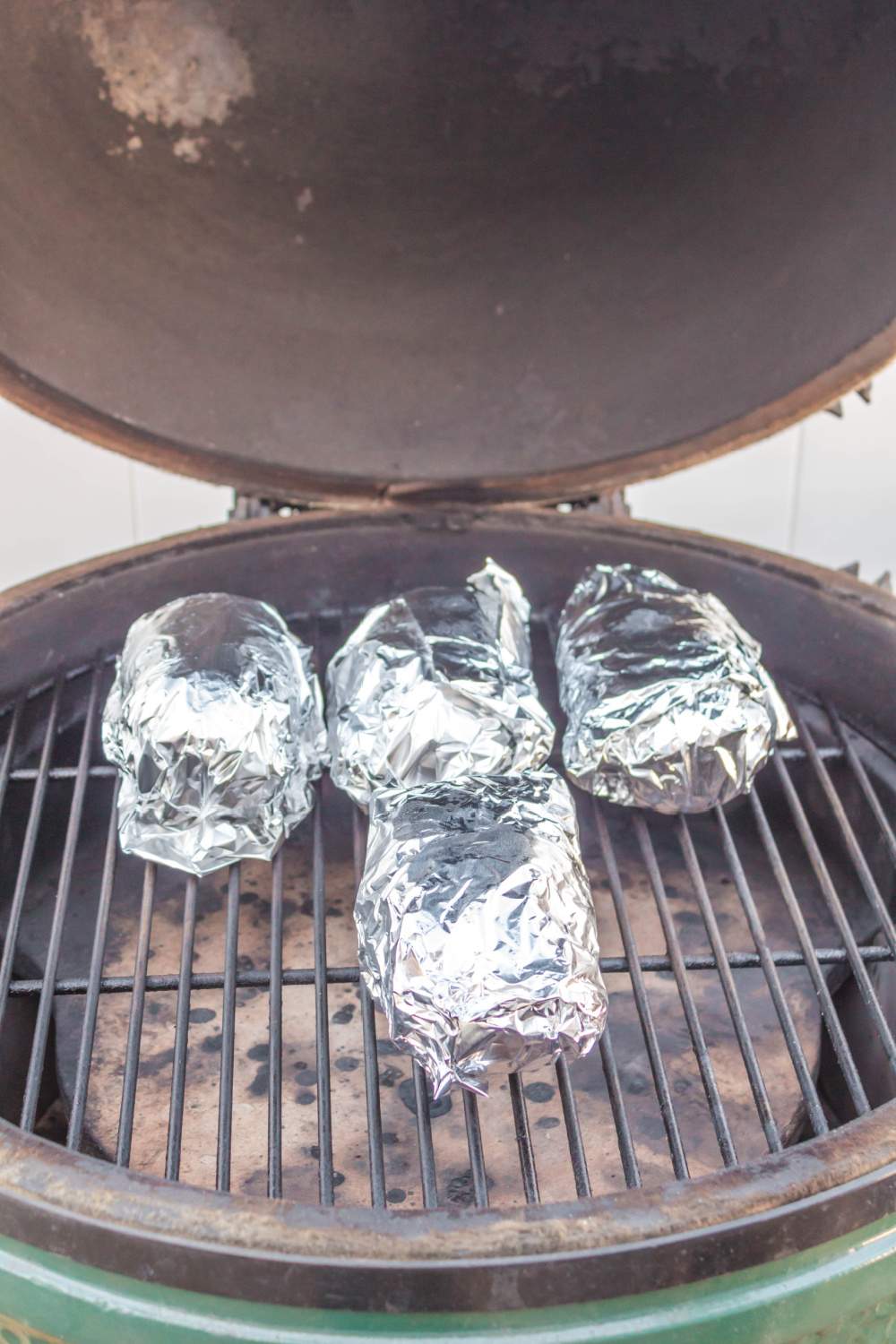potatoes wrapped in foil on grill