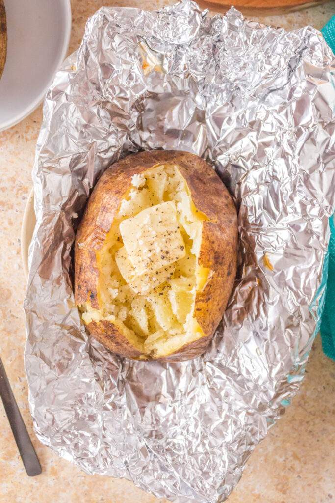 Grilled baked potato in foil