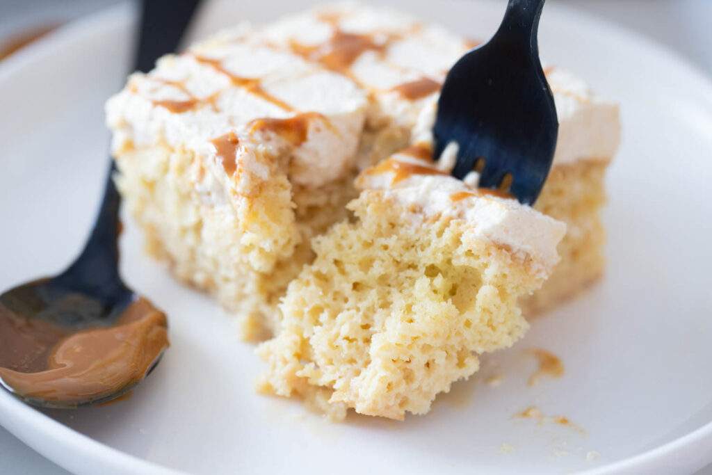 piece of Caramel Tres Leche cake on a plate