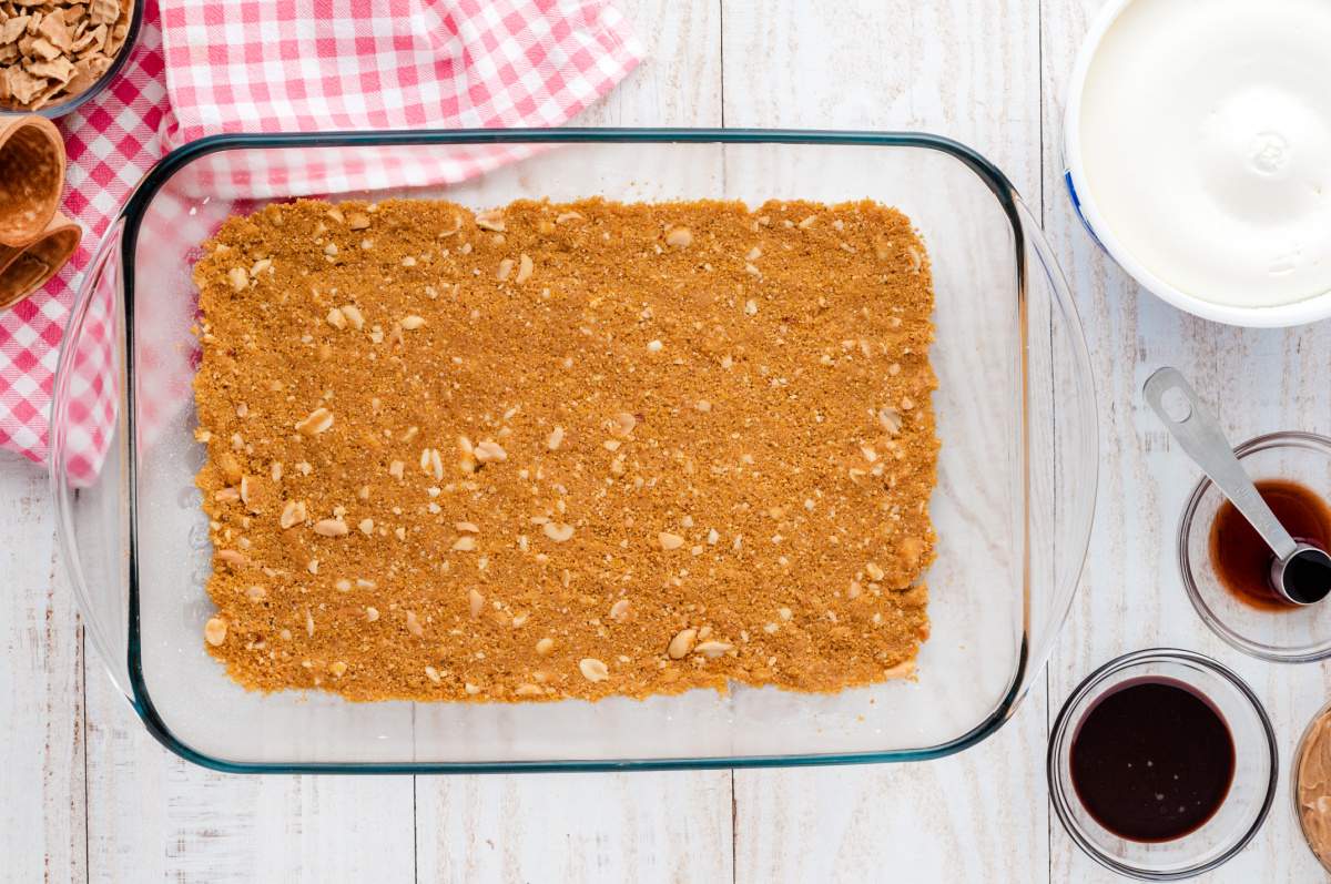 crumb mixture pressing into bottom of pan