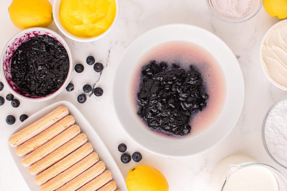 blueberry preserves and the lemon juice in a bowl