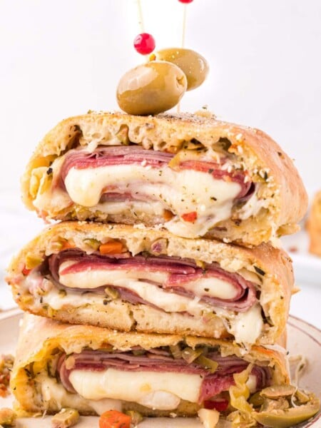 Muffuletta Garbage Bread stacked on a plate