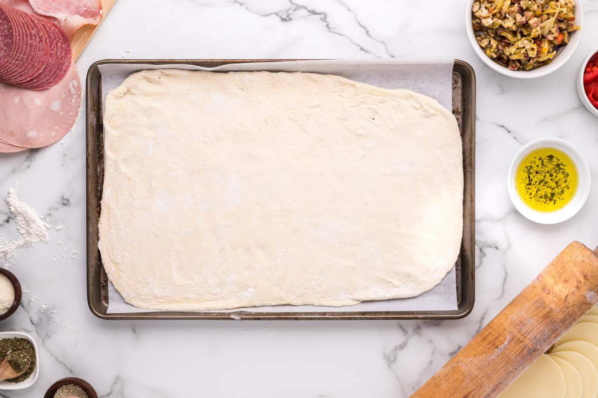 rolled out dough on a baking sheet