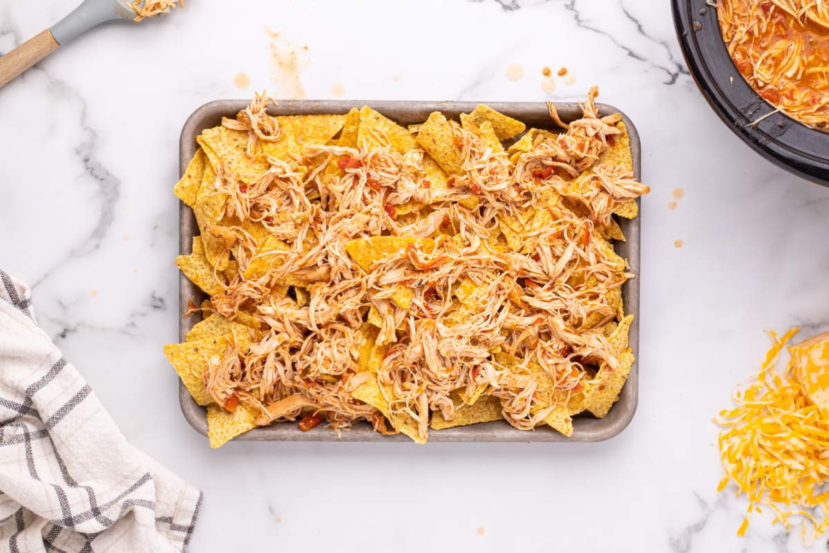 shredded chicken added on top of tortilla chips