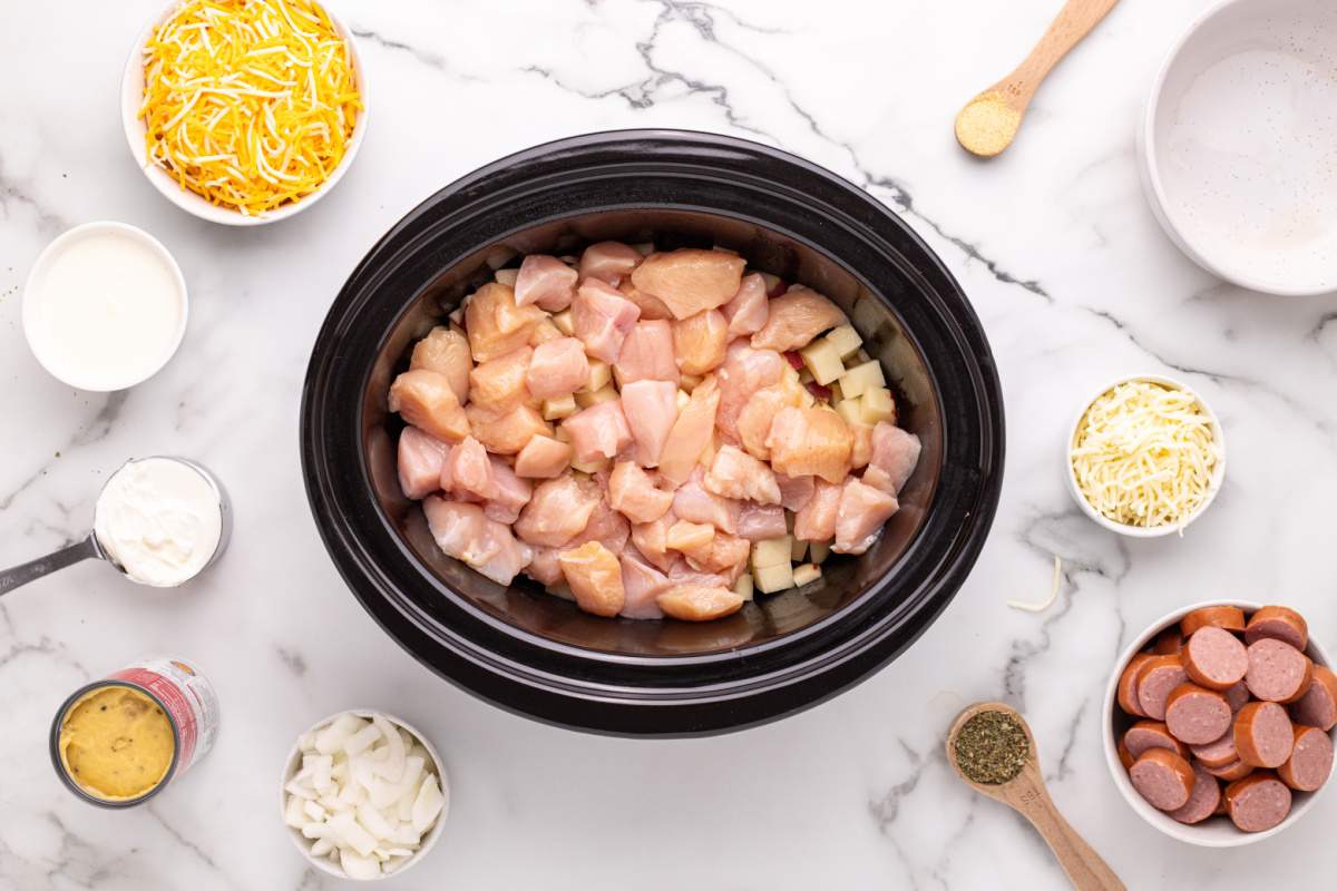 chicken pieces added to slow cooker