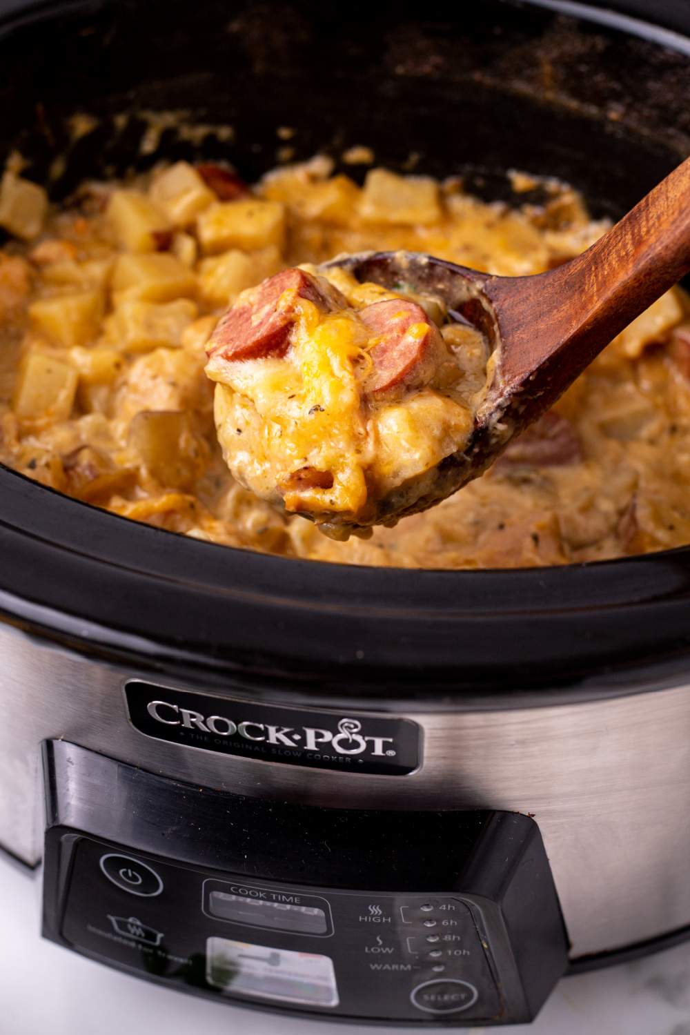 Crockpot Cheesy Chicken, Sausage, and Potato Casserole in slow cooker
