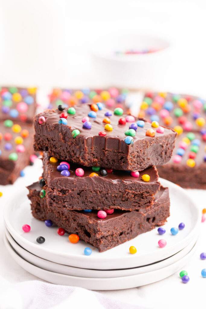 Copycat cosmic brownies stacked on a plate