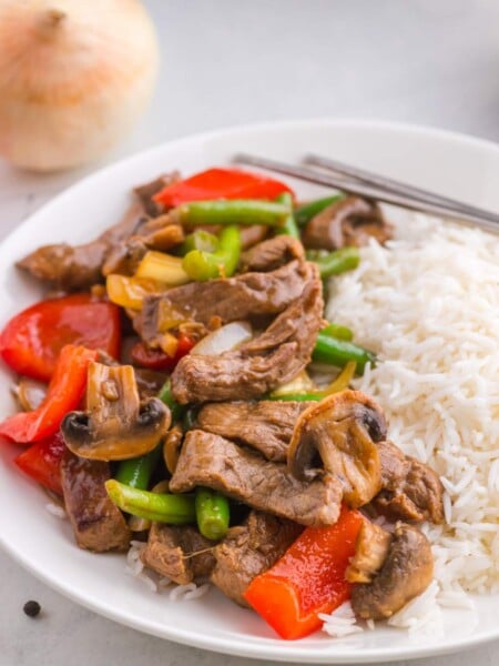 Copycat Panda Express Black Pepper Beef on a plate with rice