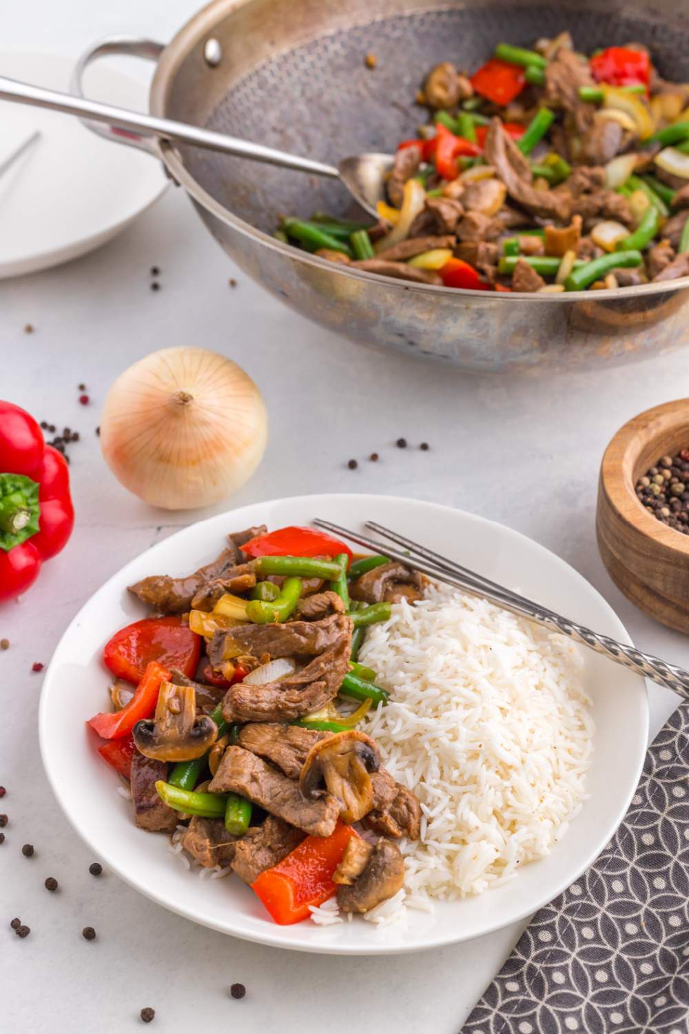 Copycat Panda Express Black Pepper Beef on a plate with rice