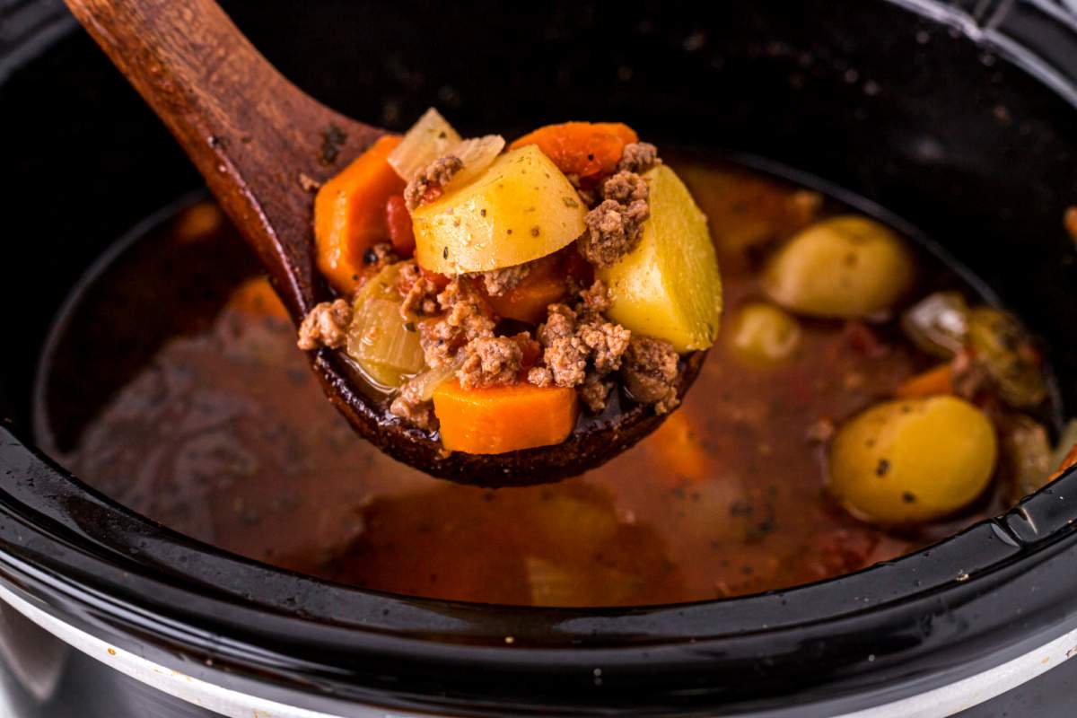 spoon scooping up some slow cooker poor man's stew