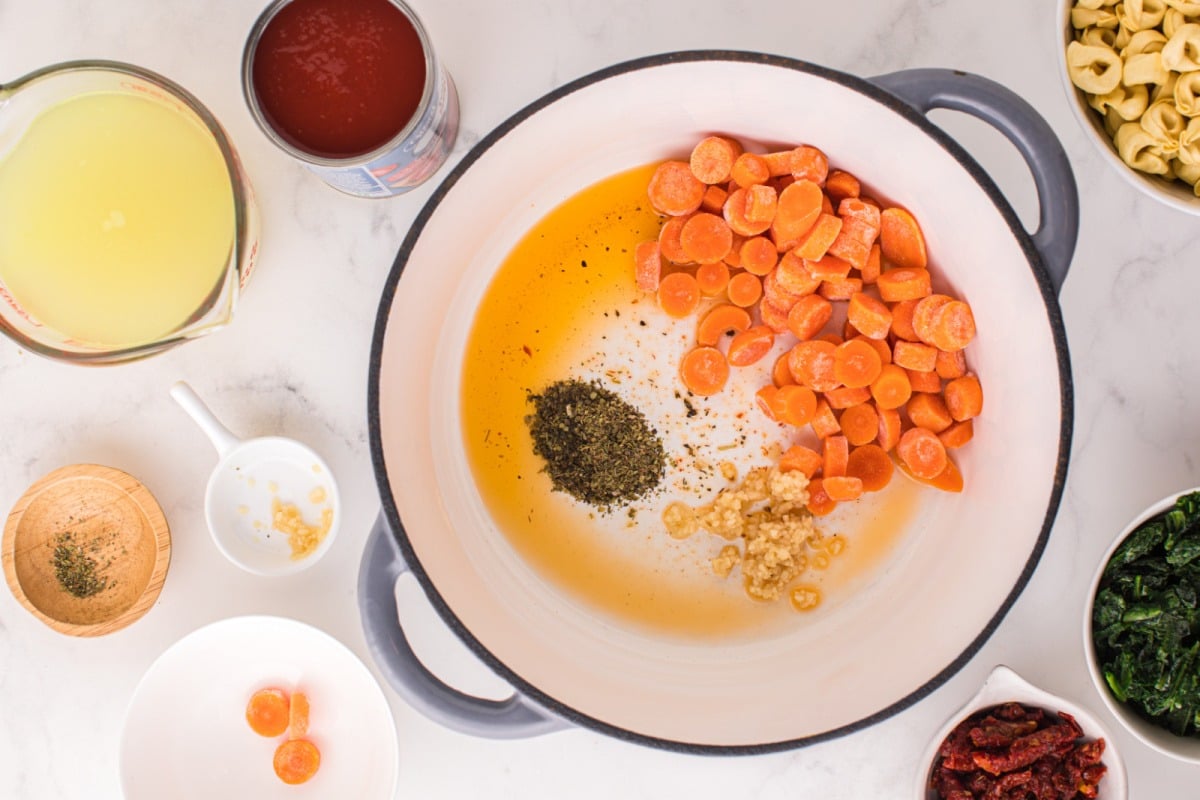 carrots, minced garlic, and Italian seasoning in a pot