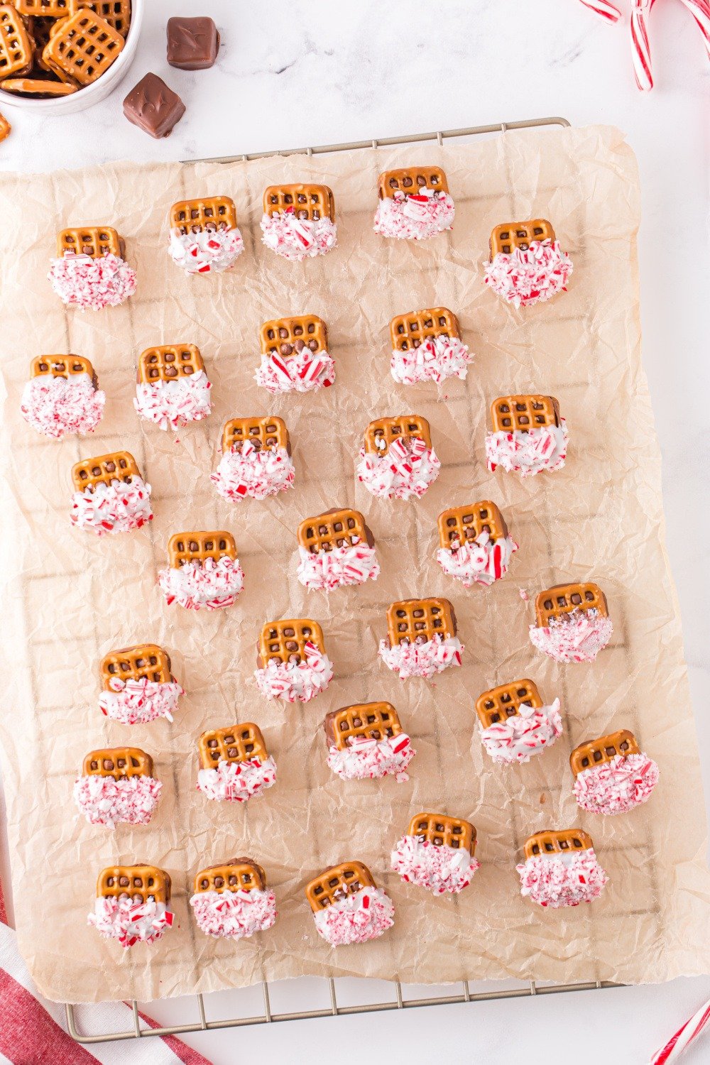 Christmas Caramel Pretzel Bites on drying sheet