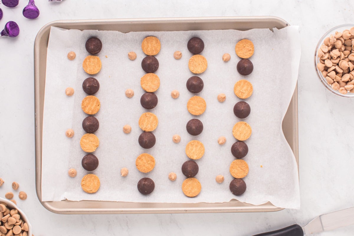 kisses, cookies and pb chips on baking sheet