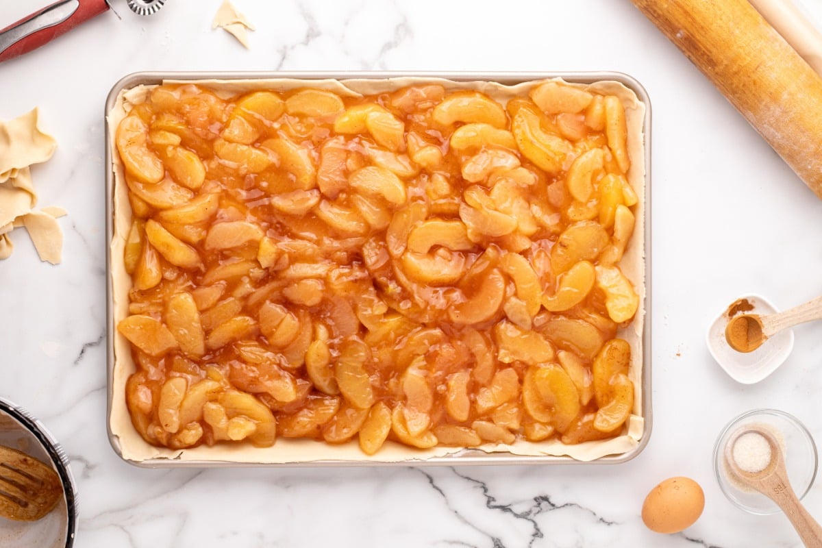 apple pie filling spread on top of pie crust