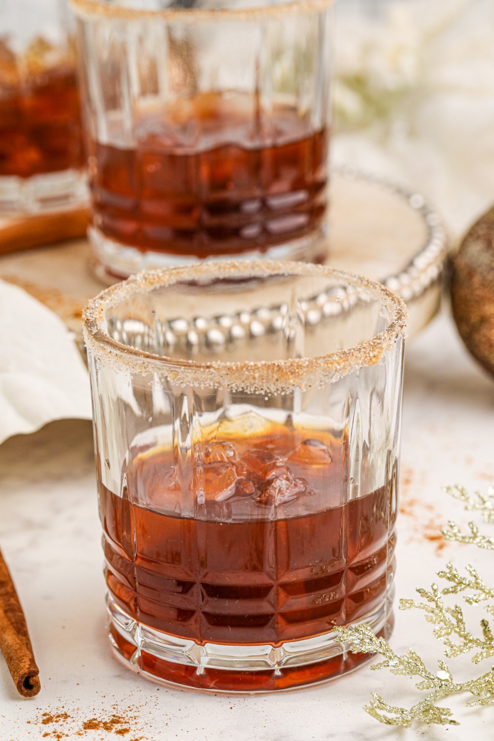 vanilla vodka, coffee liqueur and cinnamon whiskey in a cocktail glass