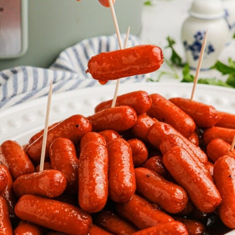 Slow Cooker Spicy Sweet BBQ Lil Smokies on a plate with toothpicks