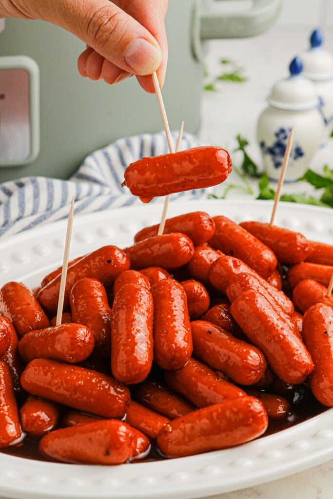 Slow Cooker Spicy Sweet BBQ Lil Smokies on a plate with toothpicks