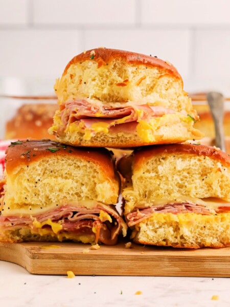 Honey Mustard Ham and Cheese Sliders stacked on a platter