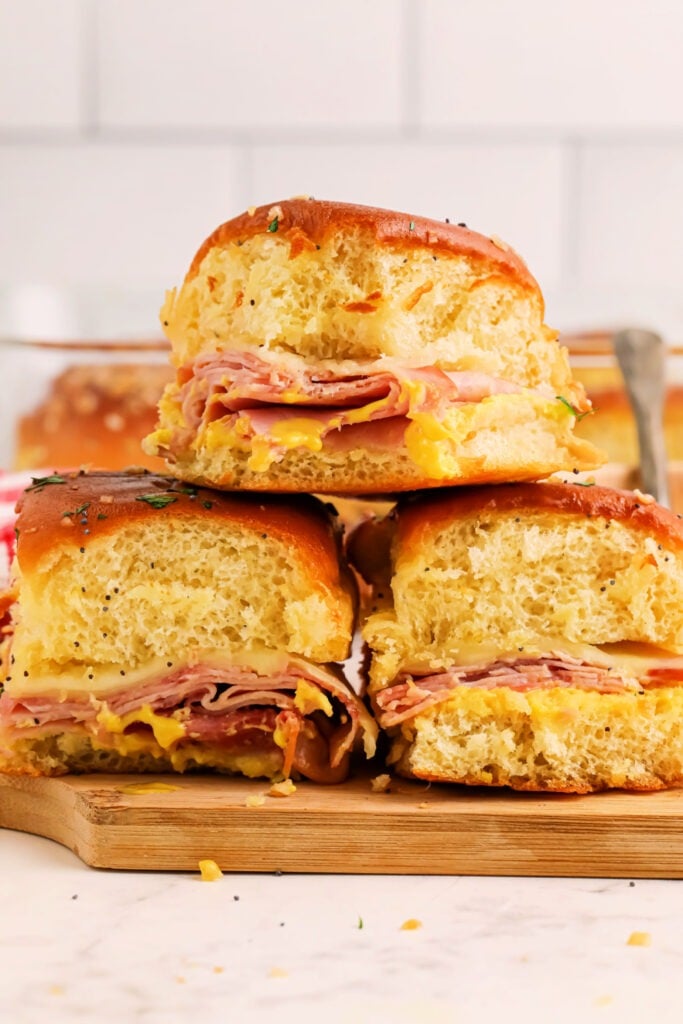 Honey Mustard Ham and Cheese Sliders stacked on a platter
