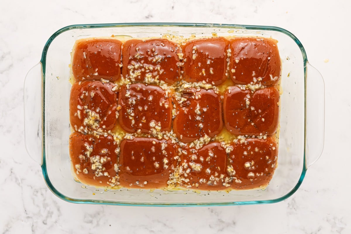 butter mixture spread on top of buns