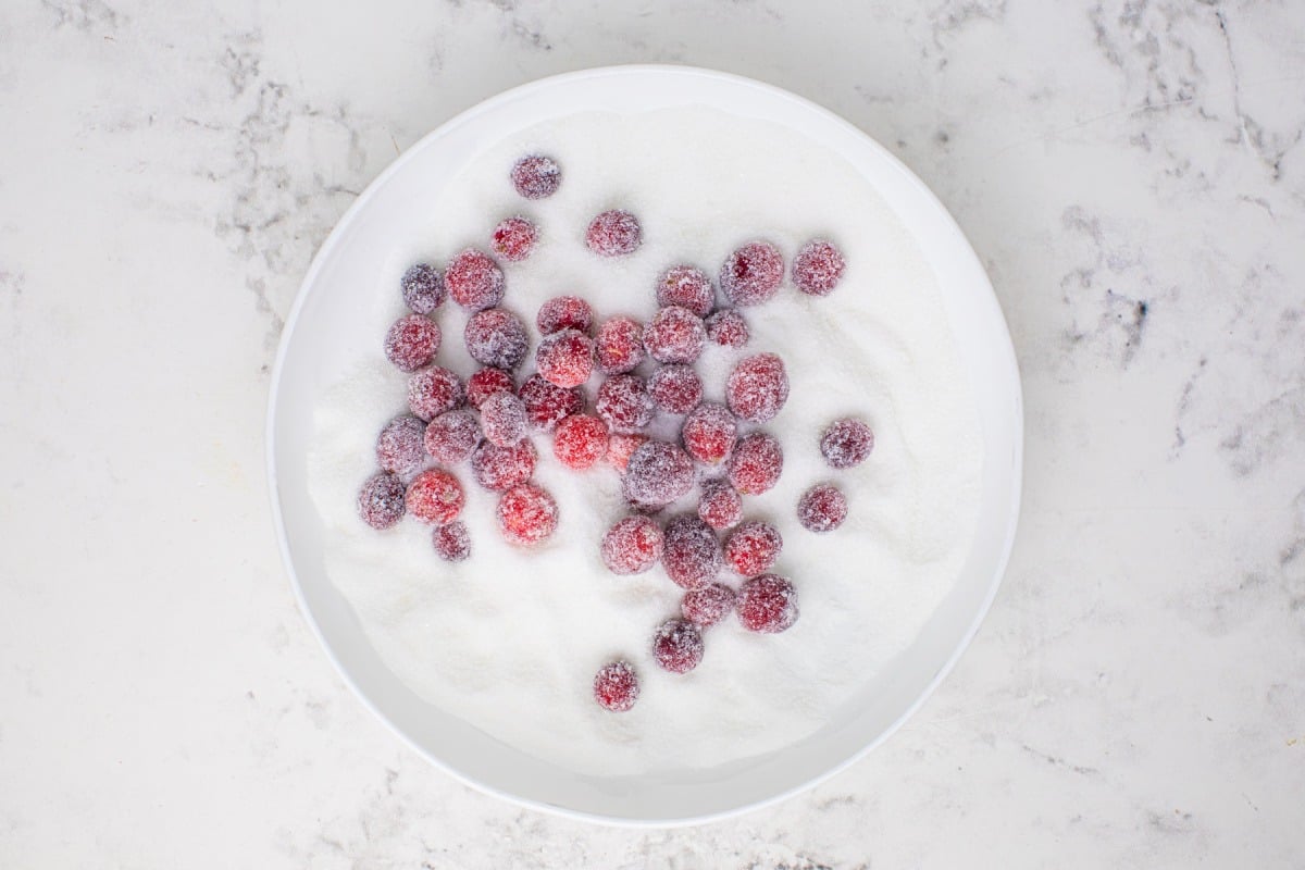 tossing cranberries in sugar