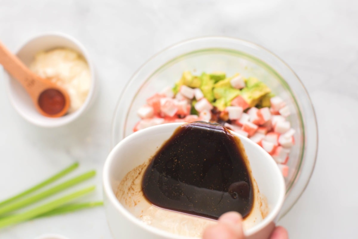 pouring soy sauce over crab mixture