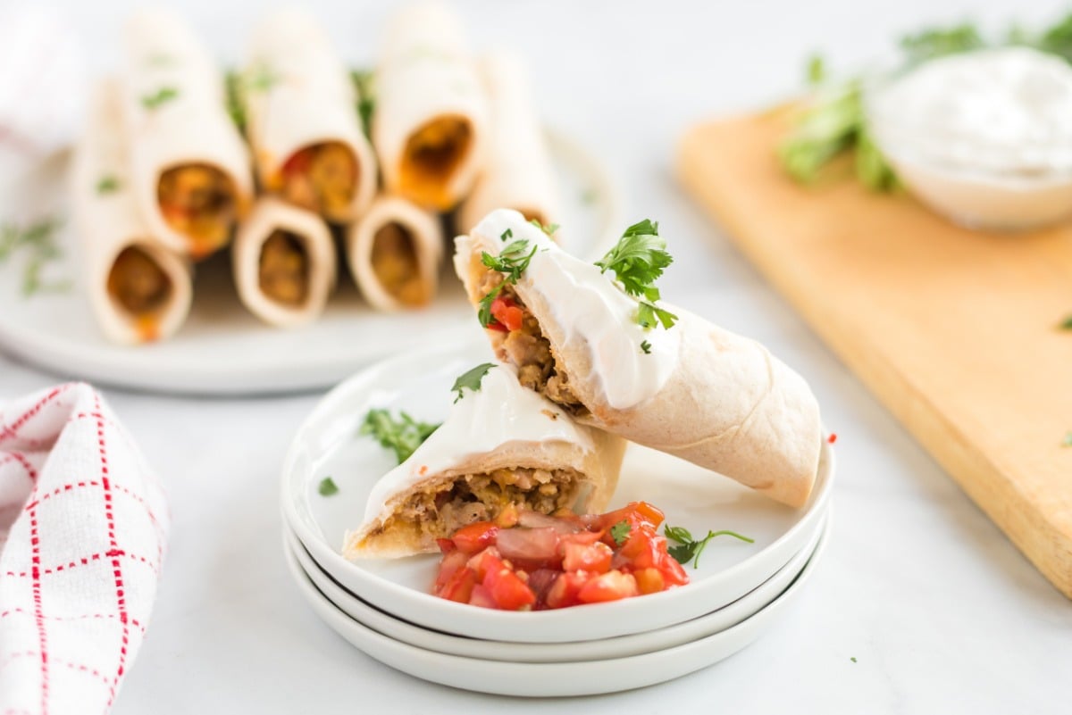 Freezer Friendly Breakfast Taquitos on white plates