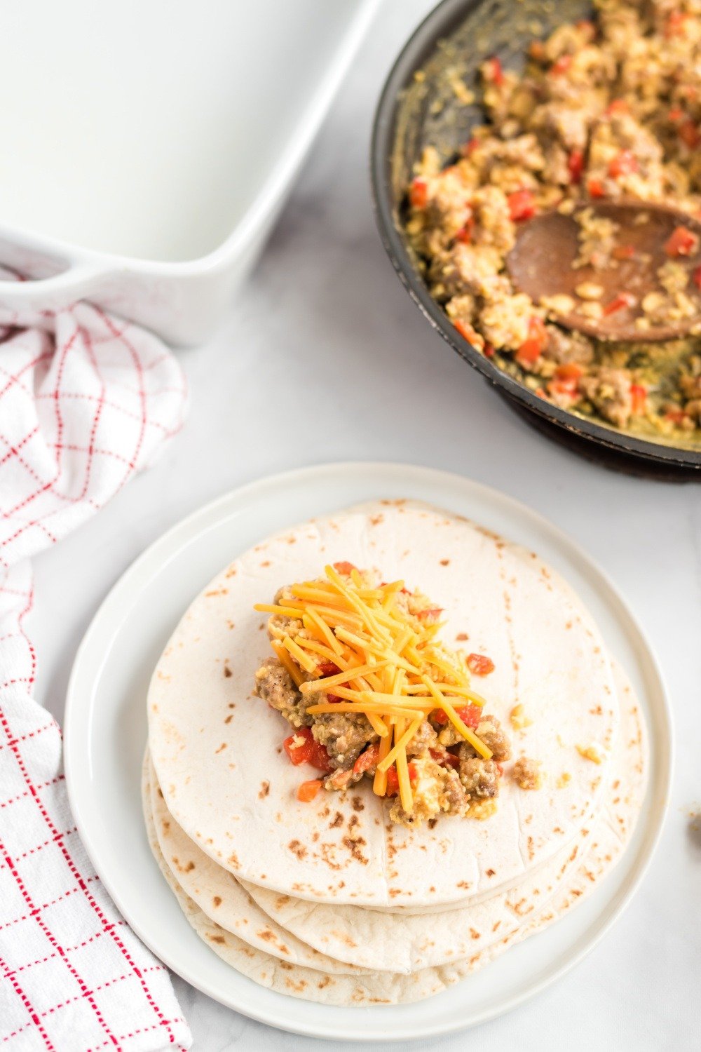 sausage mixture placed on tortilla