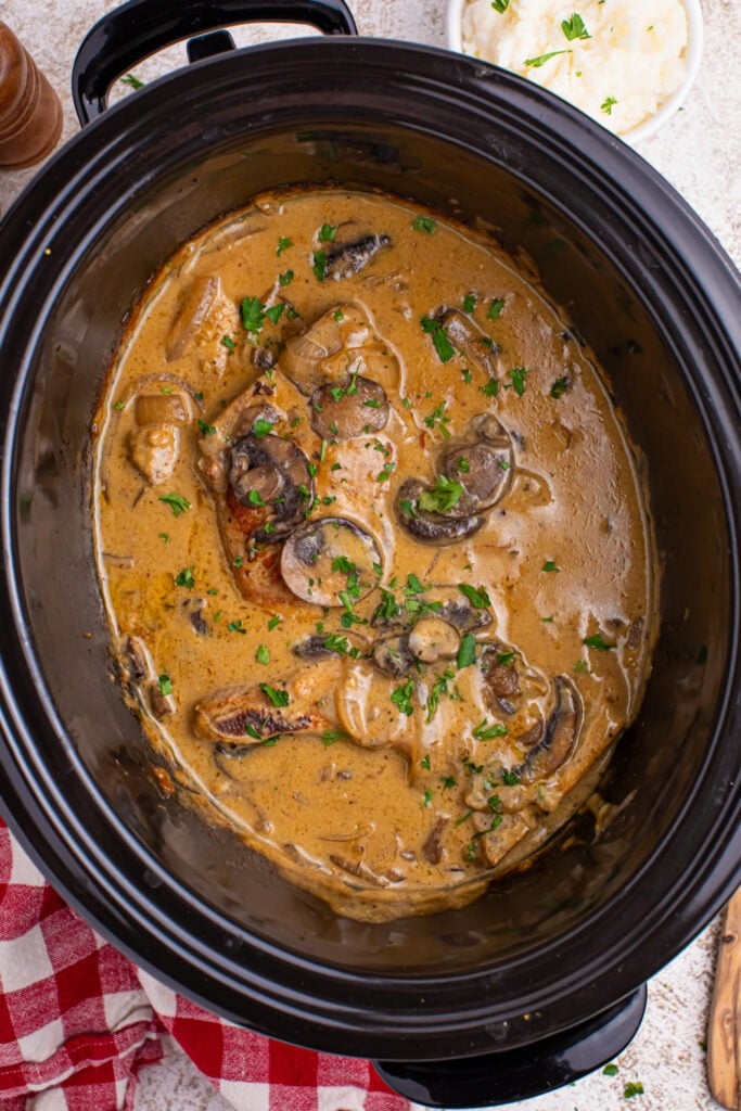 Slow Cooker Pork Chops with Mushroom Gravy in a slow cooker