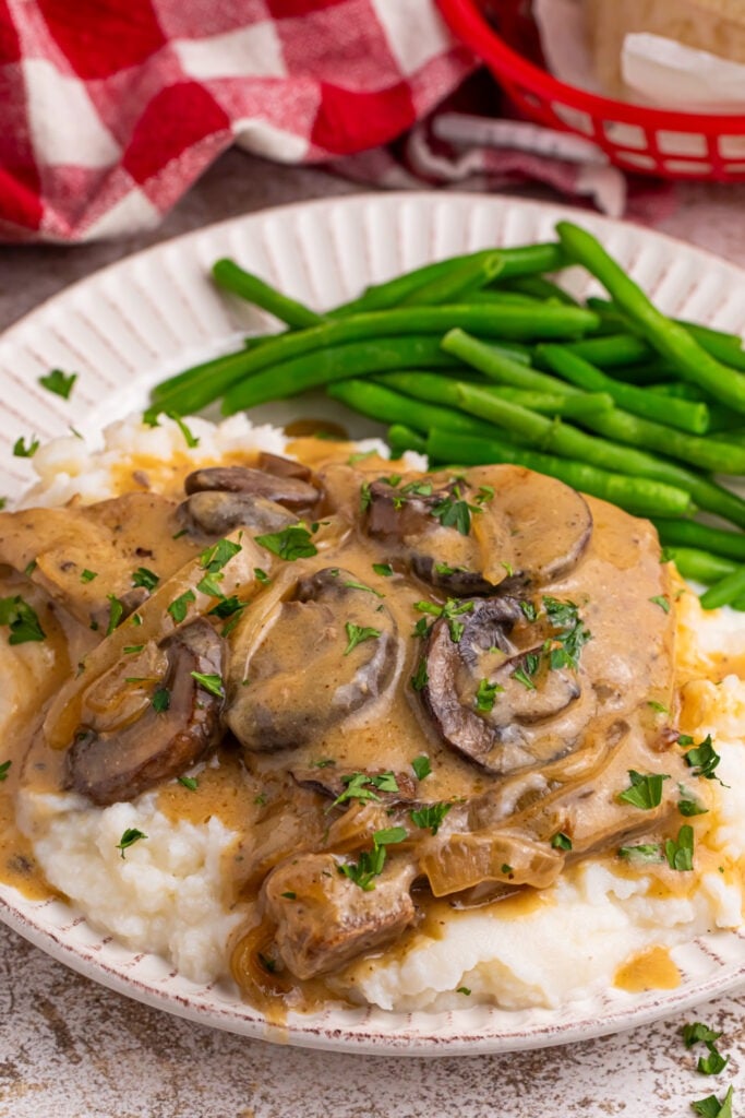 Slow Cooker Pork Chops with Mushroom Gravy on a plate 