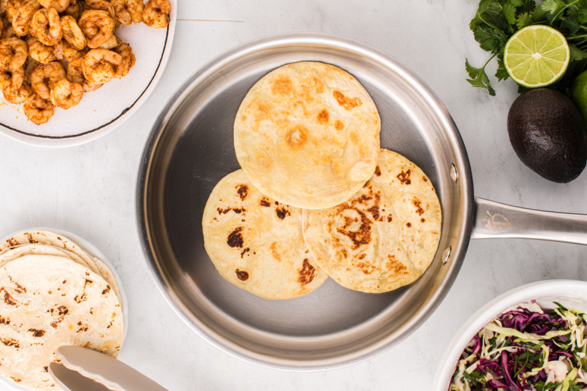 tortillas warming in a pan