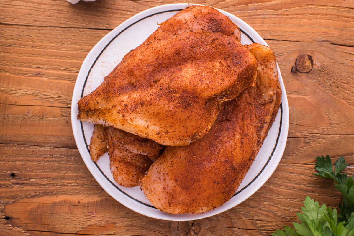 seasoning rubbed on thin chicken breast