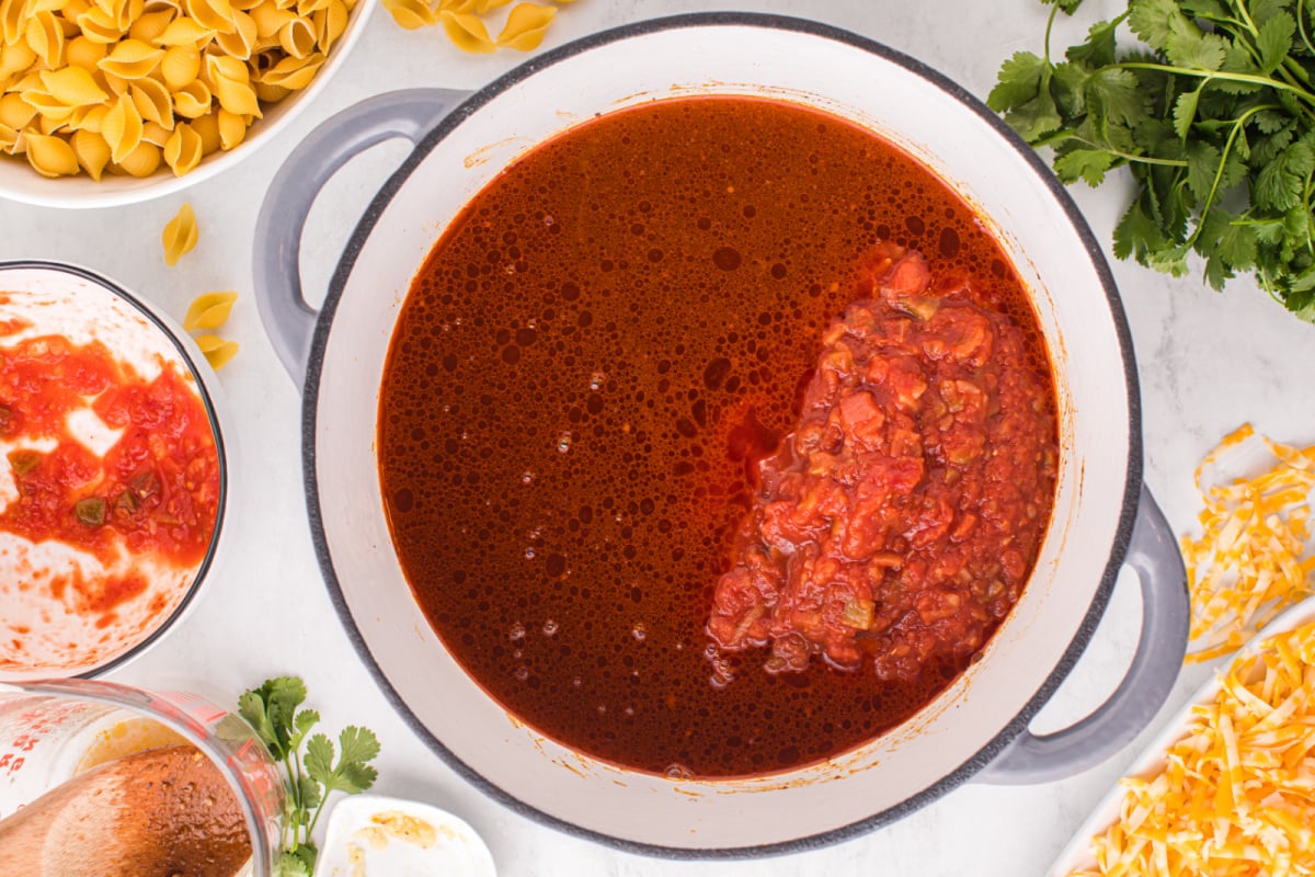 salsa and beef broth added to the pot